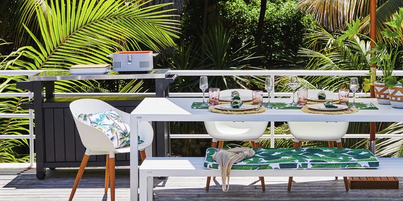 Outdoor living furniture and table setting.