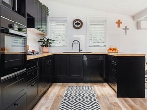 Black kitchen with white walls