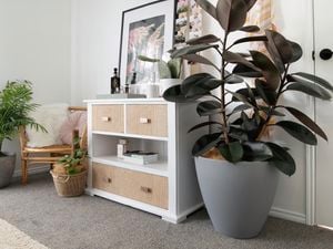 White chest of drawers with hessian covering on drawer fronts