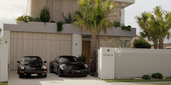 Deco is placed on house with cars also parked for effect